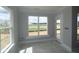 Bright room with large windows, offers natural light and views, perfect for relaxation or productivity at 12524 Morning Ridge Way, Noblesville, IN 46060