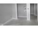 This is a room with light gray walls, white trim and bare concrete floors at 12524 Morning Ridge Way, Noblesville, IN 46060