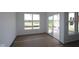 Bright room with large windows, sliding glass doors, and new construction finishes at 12532 Morning Ridge Way, Noblesville, IN 46060
