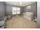 Bright Bedroom features a white crib, gray walls, and soft, neutral carpet, creating a calming space at 12845 Touchdown Dr, Fishers, IN 46037