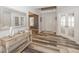 Bright foyer with wood floors, a decorative table, and views of a living area at 12845 Touchdown Dr, Fishers, IN 46037