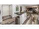 Open concept kitchen with a breakfast bar overlooking the adjacent living area at 12845 Touchdown Dr, Fishers, IN 46037