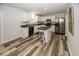 Modern kitchen featuring white cabinets, stainless steel appliances, and an island with seating at 12845 Touchdown Dr, Fishers, IN 46037