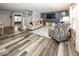Spacious living room with fireplace, wood floors, and access to stairs at 12845 Touchdown Dr, Fishers, IN 46037