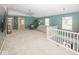 Spacious upstairs living area with plush carpeting, ceiling fan and lots of natural light at 12845 Touchdown Dr, Fishers, IN 46037