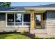 A closer view of the home's entrance, showcasing a stylish wooden door at 130 N High School Rd, Indianapolis, IN 46214