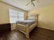 Guest bedroom featuring hardwood floors, a queen sized bed, and a ceiling fan at 1442 Bank Pl, Indianapolis, IN 46231