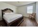 Bright bedroom with laminate flooring, a queen bed, natural light, and furniture at 1442 Bank Pl, Indianapolis, IN 46231