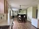 Open-concept dining area flowing into the living room, ideal for entertaining and Gathering meals at 1442 Bank Pl, Indianapolis, IN 46231