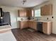 Bright kitchen featuring practical layout, stainless steel appliances and wooden cabinets at 1442 Bank Pl, Indianapolis, IN 46231