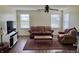 Inviting living room with a sofa, chair, area rug, ceiling fan, and natural light at 1442 Bank Pl, Indianapolis, IN 46231