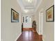 Inviting foyer with hardwood floors, elegant decor, and natural lighting at 1457 Birdsong Dr, Westfield, IN 46074