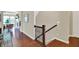 Inviting entryway with gleaming hardwood floors, decorative staircase, and access to a bright living area at 1457 Birdsong Dr, Westfield, IN 46074