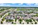 Stunning aerial view of a Gathering-friendly neighborhood with a lake, green spaces, and beautifully landscaped yards at 1457 Birdsong Dr, Westfield, IN 46074