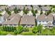 Scenic aerial view of a meticulously landscaped neighborhood, showcasing diverse architectural styles and mature trees at 1457 Birdsong Dr, Westfield, IN 46074
