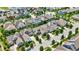 Detailed aerial view of a residential area with diverse home styles, mature trees, and manicured lawns at 1457 Birdsong Dr, Westfield, IN 46074