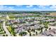 Expansive aerial view of residential community featuring a pond, mature trees, and well-maintained streets at 1457 Birdsong Dr, Westfield, IN 46074