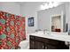 Well-lit bathroom with a vanity, large mirror, and decorative shower curtain at 1457 Birdsong Dr, Westfield, IN 46074