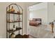 Comfortable bedroom with a serene atmosphere, plush carpeting, and a view into hallway at 1457 Birdsong Dr, Westfield, IN 46074