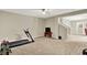 Finished basement with gym equipment and ample space, perfect for recreation and fitness at 1457 Birdsong Dr, Westfield, IN 46074