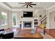 Living room featuring fireplace, open doorway to bedroom, and a sliding glass door leading to the outdoors at 1457 Birdsong Dr, Westfield, IN 46074