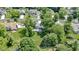 Aerial view showcases the home's expansive yard, mature trees, deck, and gazebo at 15120 Romalong Ln, Carmel, IN 46032