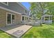 Spacious backyard with a patio, deck, gazebo, well-maintained lawn, and mature trees providing shade at 15120 Romalong Ln, Carmel, IN 46032