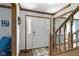 Entryway featuring hardwood floors, wood trim, and a staircase leading to the upper level at 15120 Romalong Ln, Carmel, IN 46032