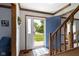 Bright entryway with hardwood floors, staircase, and view to the outside at 15120 Romalong Ln, Carmel, IN 46032