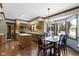 Bright eat-in kitchen featuring wood cabinets, island, modern appliances, and a large bay window at 15120 Romalong Ln, Carmel, IN 46032