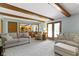 Open-concept living room providing direct access to the bright kitchen area at 15120 Romalong Ln, Carmel, IN 46032