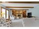 Cozy living room with brick fireplace, built-in shelves, and comfortable seating at 15120 Romalong Ln, Carmel, IN 46032