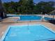 Community pool featuring a fenced in pool, baby pool, and lounge chairs at 15120 Romalong Ln, Carmel, IN 46032