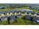 A community view featuring a pond and various homes with lush greenery at 15736 Conductors Dr, Westfield, IN 46074