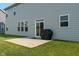 Backyard patio with gray siding and a black grill at 15736 Conductors Dr, Westfield, IN 46074