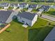 Aerial view of a home's backyard including a well manicured lawn and nearby houses at 15736 Conductors Dr, Westfield, IN 46074