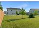 Wide-open backyard with beautiful grass and mature trees provides a private oasis and curb appeal at 15736 Conductors Dr, Westfield, IN 46074