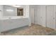 The bathroom has a double vanity, modern cabinets, and a view to the shower at 15736 Conductors Dr, Westfield, IN 46074