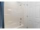 Clean bathroom features a standard tub with a shower and a blue shower curtain at 15736 Conductors Dr, Westfield, IN 46074