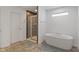 The bathroom features a soaking tub and glass-enclosed tiled shower stall at 15736 Conductors Dr, Westfield, IN 46074