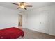 Bedroom featuring neutral carpet, a ceiling fan, and a doorway to the bathroom at 15736 Conductors Dr, Westfield, IN 46074