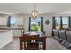 Bright dining area with a modern light fixture and views of the outside at 15736 Conductors Dr, Westfield, IN 46074
