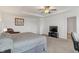 The main bedroom offers a tray ceiling, carpet, a TV, and neutral walls at 15736 Conductors Dr, Westfield, IN 46074