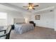 The main bedroom features a ceiling fan, upholstered headboard, and a leather chair at 15736 Conductors Dr, Westfield, IN 46074
