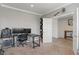 Spacious home office with neutral walls, carpeted flooring, and a modern desk setup at 15736 Conductors Dr, Westfield, IN 46074