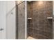 The bathroom includes a tiled walk-in shower with glass door and shelving at 15736 Conductors Dr, Westfield, IN 46074