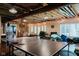 Spacious finished basement area featuring ping pong table, exposed rafters, and recessed lights at 16307 Stony Ridge Dr, Noblesville, IN 46060