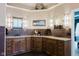 Elegant bathroom with dual sinks, wooden cabinetry, and stylish lighting fixtures at 16307 Stony Ridge Dr, Noblesville, IN 46060