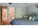A cozy bedroom with a bed, a mirrored vanity, and a view into an en-suite bathroom at 16307 Stony Ridge Dr, Noblesville, IN 46060