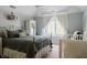A Bedroom or bedroom with a metal-framed bed, a crib, and elegant ruffled curtains at 16307 Stony Ridge Dr, Noblesville, IN 46060